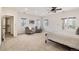 Spacious main bedroom boasts seating area, ceiling fan, and access to a balcony at 6071 S Detroit St, Centennial, CO 80121