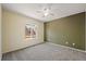 Bright bedroom with neutral walls, well-lit by natural light, provides a peaceful and inviting space at 5932 S Versailles St, Aurora, CO 80015