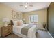 Cozy bedroom with a comfy bed, soft natural light, and stylish decorative accents at 5932 S Versailles St, Aurora, CO 80015