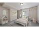 Bright bedroom with a map wall hanging and colorful decor, creating a cozy and inviting atmosphere at 5932 S Versailles St, Aurora, CO 80015