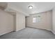 Empty room with neutral walls and carpet offers versatile space for customization and personalization at 5932 S Versailles St, Aurora, CO 80015