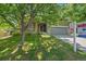Charming home with a two-car garage, mature trees, and a well-maintained lawn at 5932 S Versailles St, Aurora, CO 80015