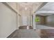 Inviting foyer with a soaring ceiling, a chandelier, wood floors and neutral paint at 5932 S Versailles St, Aurora, CO 80015