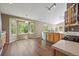 Bright eat-in kitchen features wood cabinets, ample counter space, and a bay window at 5932 S Versailles St, Aurora, CO 80015