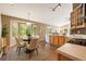 An eat-in kitchen with wood cabinets, ample counter space, and a bay window at 5932 S Versailles St, Aurora, CO 80015