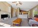 Open living room featuring neutral tones, plush carpet, and seamless flow into the modern kitchen space at 5932 S Versailles St, Aurora, CO 80015