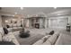 Spacious living room features a fireplace, recessed lighting, and neutral decor, creating a cozy and inviting atmosphere at 5932 S Versailles St, Aurora, CO 80015