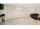 Finished basement features carpet, a window, and a sofa at 9825 W Walker Pl, Littleton, CO 80123