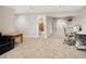 Finished basement with a view into the full bathroom, showcasing the usability of the space at 9825 W Walker Pl, Littleton, CO 80123