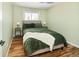 Cozy bedroom features neutral walls, ceiling fan, and generous natural light at 9825 W Walker Pl, Littleton, CO 80123