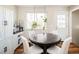 Bright dining area with natural light, hardwood floors, and cozy furniture at 9825 W Walker Pl, Littleton, CO 80123