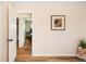 Hallway showing bedroom views and a picture frame at 9825 W Walker Pl, Littleton, CO 80123