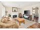 Cozy living room features a fireplace, comfortable seating, and stylish decor at 9825 W Walker Pl, Littleton, CO 80123