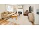 Open living room with a fireplace, lots of space, and a seamless flow at 9825 W Walker Pl, Littleton, CO 80123