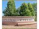 Entrance sign to Kipling Villas, neighborhood and local area attraction at 9825 W Walker Pl, Littleton, CO 80123