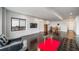 Finished basement includes entertainment area, dark wood floors, and sleek furniture at 8765 Canyon Wind St, Parker, CO 80138