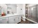 Modern bathroom featuring sleek vanity with a white countertop and glass-enclosed shower at 8765 Canyon Wind St, Parker, CO 80138