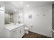 Bathroom features a glass shower, contemporary vanity, and sleek fixtures at 8765 Canyon Wind St, Parker, CO 80138