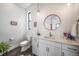 Modern bathroom features white cabinets, granite counters, and bronze fixtures at 8765 Canyon Wind St, Parker, CO 80138