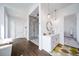 Elegant bathroom with a modern walk-in shower, soaking tub, and double sink vanity on a dark wood floor at 8765 Canyon Wind St, Parker, CO 80138