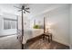 Bedroom features a four-poster bed, neutral decor, and a cozy ambiance at 8765 Canyon Wind St, Parker, CO 80138