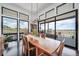 Dining room filled with lots of light, with a large table and sliding glass door that leads to an outdoor patio at 8765 Canyon Wind St, Parker, CO 80138