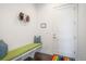 Entryway boasts hardwood floors, bench with storage, and coat rack at 8765 Canyon Wind St, Parker, CO 80138