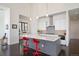 Spacious kitchen with a large center island, pendant lights, and views into the dining area at 8765 Canyon Wind St, Parker, CO 80138