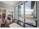 Bright and airy living room with expansive windows offering scenic views of the surrounding landscape at 8765 Canyon Wind St, Parker, CO 80138