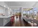 Open-concept living space with a kitchen island, dining area, and ample natural light at 8765 Canyon Wind St, Parker, CO 80138