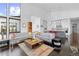 Contemporary living room with bright natural light and an open floor plan layout at 8765 Canyon Wind St, Parker, CO 80138