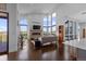 Bright and airy living area with large windows showcasing outdoor views and modern finishes at 8765 Canyon Wind St, Parker, CO 80138