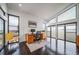 Inviting home office featuring dark hardwood floors, ample natural light, and a functional workspace at 8765 Canyon Wind St, Parker, CO 80138