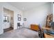 Bright home office features mid-century modern desk, shelves, and furniture at 8765 Canyon Wind St, Parker, CO 80138
