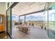 Covered outdoor patio featuring comfortable seating, a fire pit, and scenic views at 8765 Canyon Wind St, Parker, CO 80138