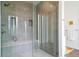 Luxurious walk-in shower featuring sleek tilework, glass enclosure, and modern fixtures for a spa-like experience at 8765 Canyon Wind St, Parker, CO 80138