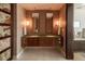 Contemporary bathroom with dual sinks, a unique stone-style wall and marble counters at 1133 14Th St # 2000, Denver, CO 80202