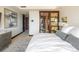Bright bedroom featuring neutral tones, modern art, and ensuite bathroom access at 1133 14Th St # 2000, Denver, CO 80202