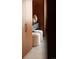 Bedroom storage featuring wood wardrobes with modern handles and comfortable ottomans at 1133 14Th St # 2000, Denver, CO 80202