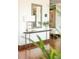Stylish entryway with a marble-topped console table, decorative mirror, and hardwood floors at 1133 14Th St # 2000, Denver, CO 80202