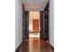 Inviting hallway with rich hardwood floors and glimpse into stylish living space at 1133 14Th St # 2000, Denver, CO 80202