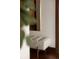 Hallway with a modern upholstered bench and dark wood flooring at 1133 14Th St # 2000, Denver, CO 80202