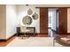 Stylish home office with a modern desk, round mirrors, and a sliding wooden door for added privacy at 1133 14Th St # 2000, Denver, CO 80202