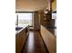 Modern kitchen with sleek cabinets, stainless steel appliances, and a city view from large windows at 1133 14Th St # 2000, Denver, CO 80202