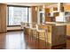 Modern kitchen with large island, wood cabinets, stainless steel appliances and city views at 1133 14Th St # 2000, Denver, CO 80202