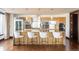 Modern kitchen featuring stainless steel appliances, a large island with seating, and sleek cabinets at 1133 14Th St # 2000, Denver, CO 80202