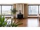Modern living room featuring hardwood floors, stylish decor, and large windows with city views at 1133 14Th St # 2000, Denver, CO 80202
