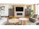 Comfortable living room with fireplace, television, hardwood floors, and decor at 1133 14Th St # 2000, Denver, CO 80202