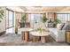 Cozy living room featuring a plush sectional sofa, modern decor, and bright lighting with a large area rug at 1133 14Th St # 2000, Denver, CO 80202