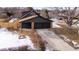 House with a two-car garage and a fenced backyard at 9962 W 77Th Ave, Arvada, CO 80005